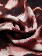Close-up of a textured silk fabric with a patterned design