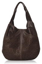 Brown leather handbag with woven pattern on a white background