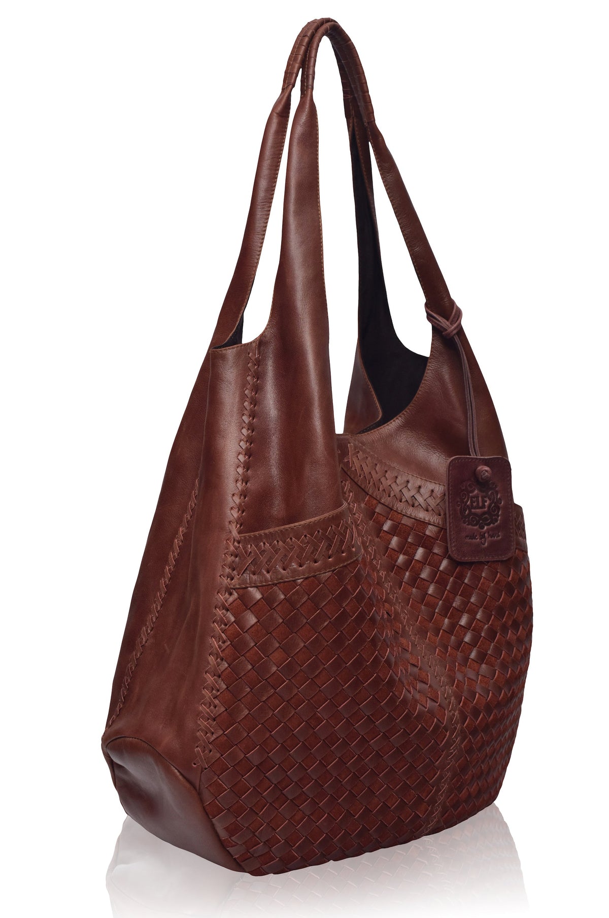 Brown leather handbag with woven pattern on a white background
