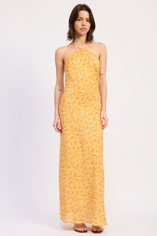 Woman wearing a Tangerine floral halter maxi dress front view fitted silhouette summer dress on a white background