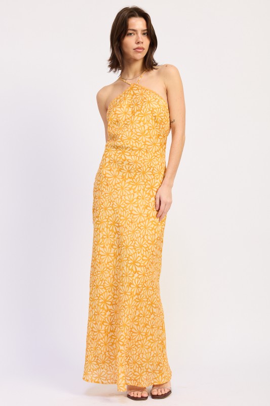 Woman wearing a Tangerine floral halter maxi dress front view fitted silhouette summer dress on a white background