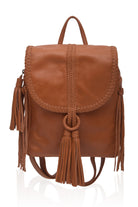 Tan leather backpack with tassels on a white background