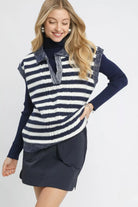 Navy and ivory striped collared sweater vest with textured knit detailing and contrast trim

