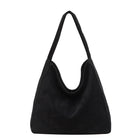 A black suede hobo shoulder bag with a single strap, photographed against a solid white background.