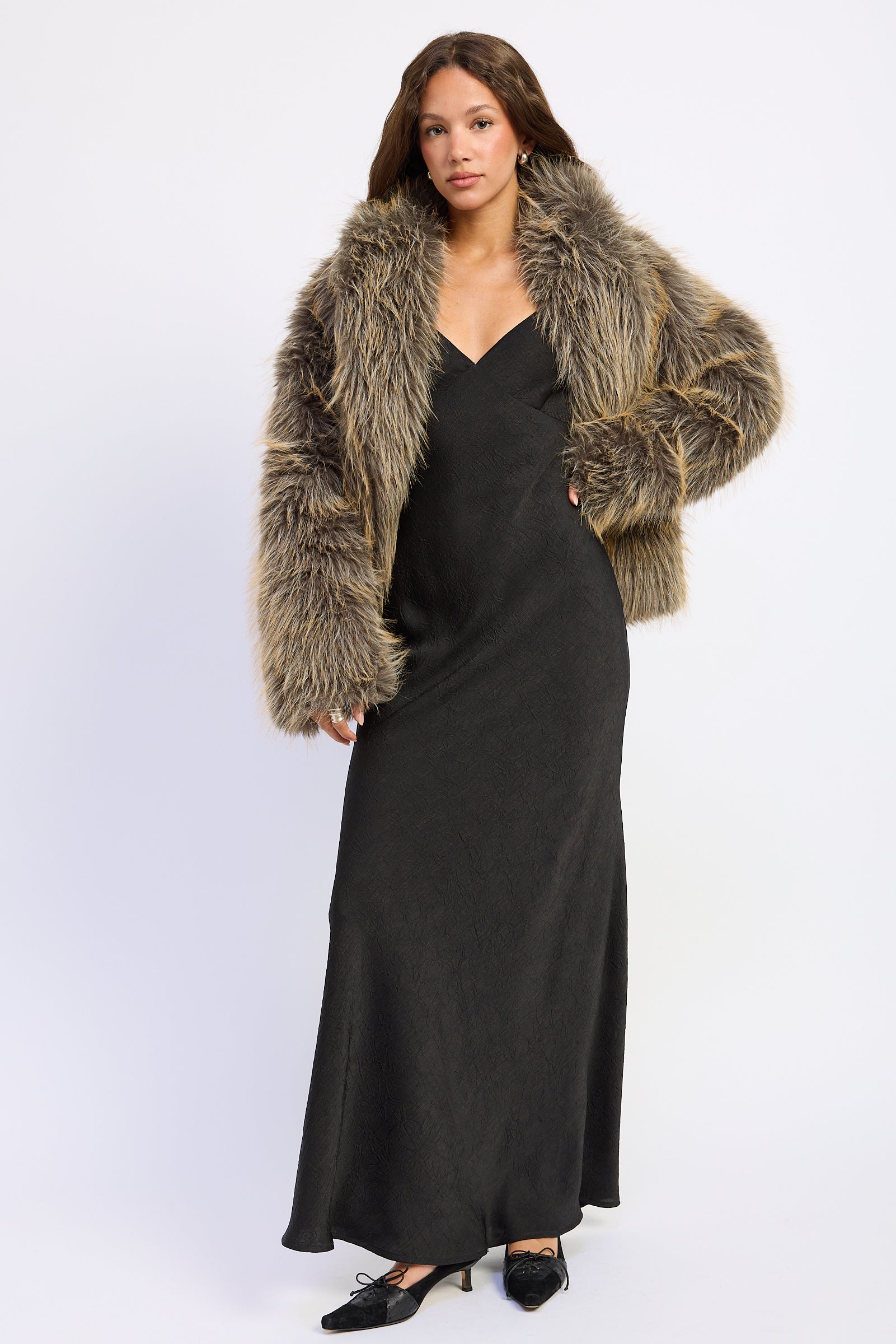 Montana Wild Faux Fur Coat styled over a black maxi dress, full front view.