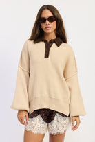 The Weekend Club Collared Knit Sweater in oatmeal with chocolate brown ribbed collar and button neckline, front view.