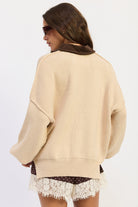 Back view of oatmeal Weekend Club Collared Knit Sweater showing exposed shoulder seams and ribbed hem.