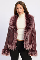 Burgundy faux leather jacket with oversized burgundy and pink shaggy faux fur collar, cuffs and hem, front view.