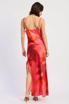 Back view of floral maxi dress with thin beaded straps, low back and side slit

