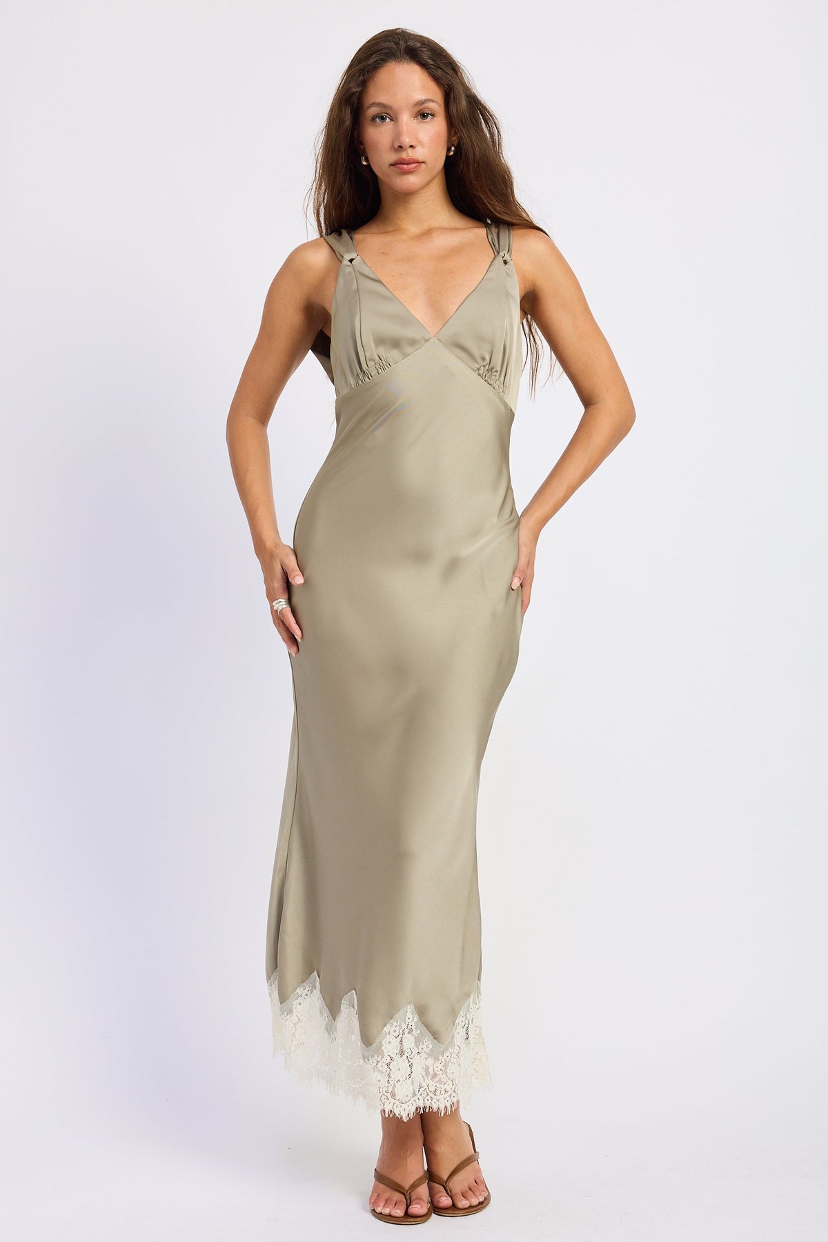 Woman wearing bias-cut satin midi dress with lace hem in Light Olive.