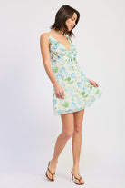 Woman wearing a floral dress on a white background