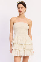 cream strapless smocked tiered mini dress front view