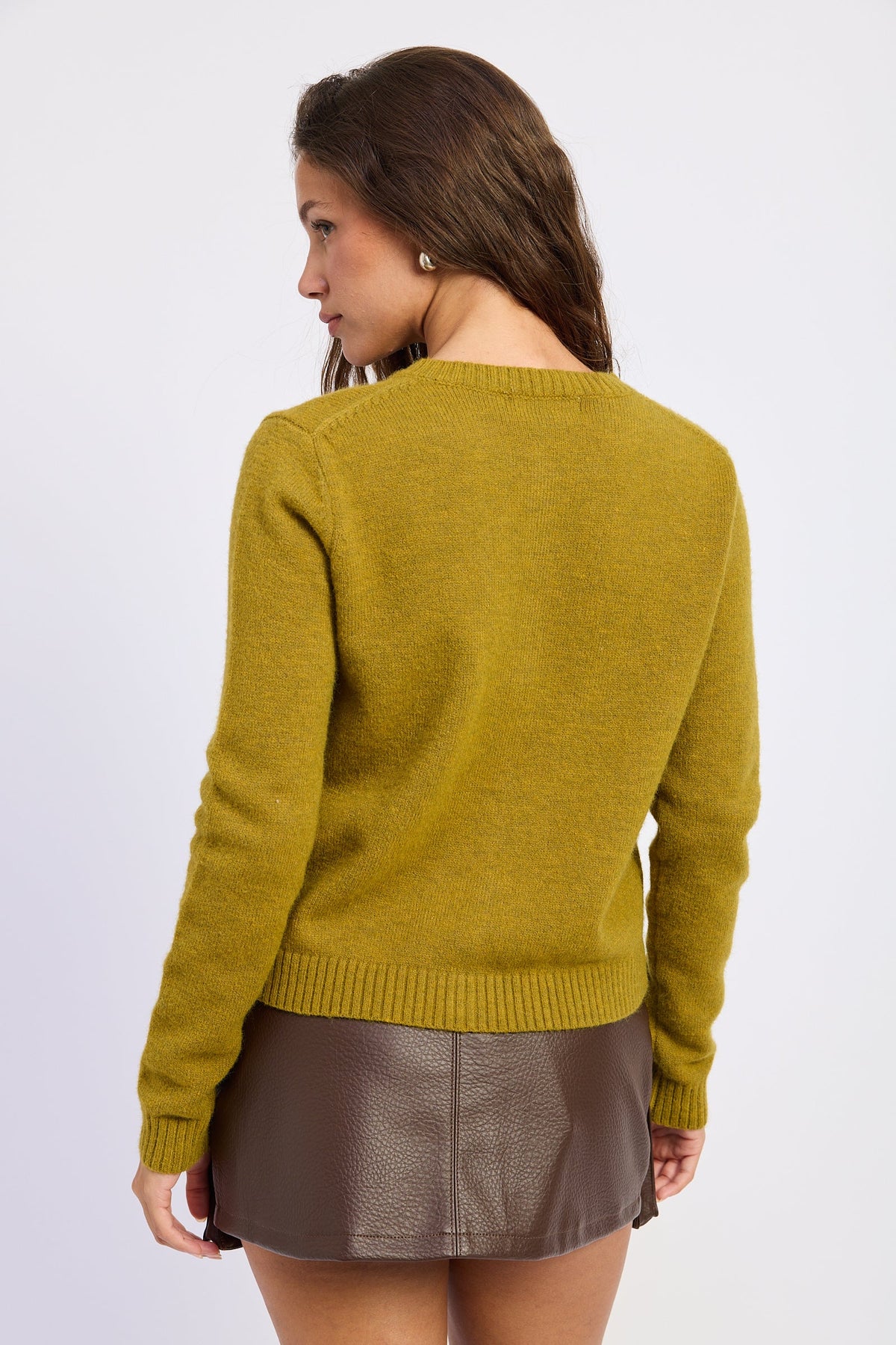 Back view of moss green knit cardigan with long sleeves and ribbed cuffs and hem.