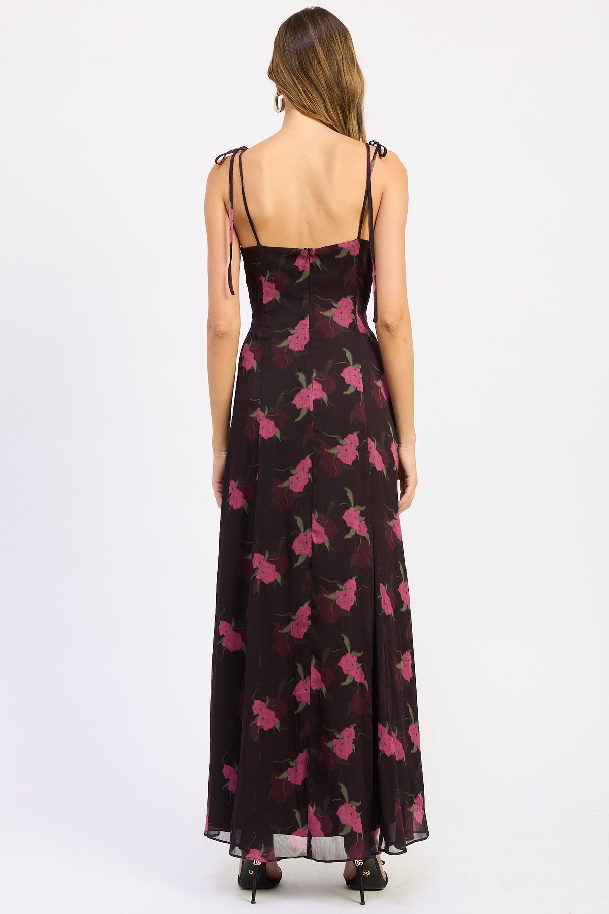 Back view of Alessandra Floral Maxi Dress with adjustable shoulder ties, back zipper and flowing floral skirt.