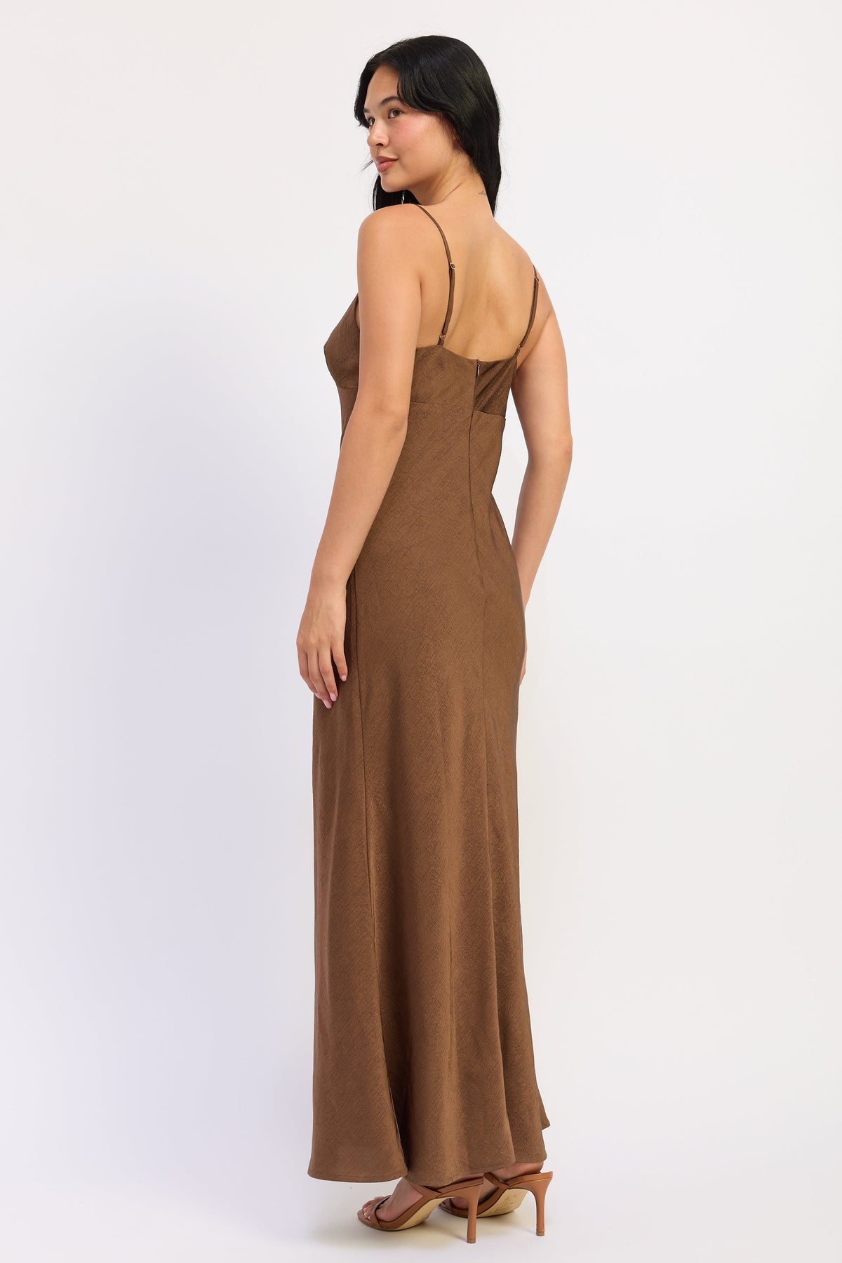 Back view of brown Sienna Satin Slip Dress with adjustable straps, zipper closure and long flowing silhouette.