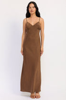 Sienna Satin Slip Dress in warm brown with V neckline, spaghetti straps and fluid maxi silhouette, front view.