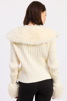 Back view of Aspen ivory ribbed knit cardigan with wide faux fur shoulder collar and matching cuffs.