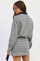 Back view of heather grey Varsity Club Striped Polo Mini Dress featuring navy horizontal stripes, contrasting collar and relaxed upper silhouette.
