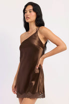 Woman wearing dark chocolate satin mini dress with lace trim.