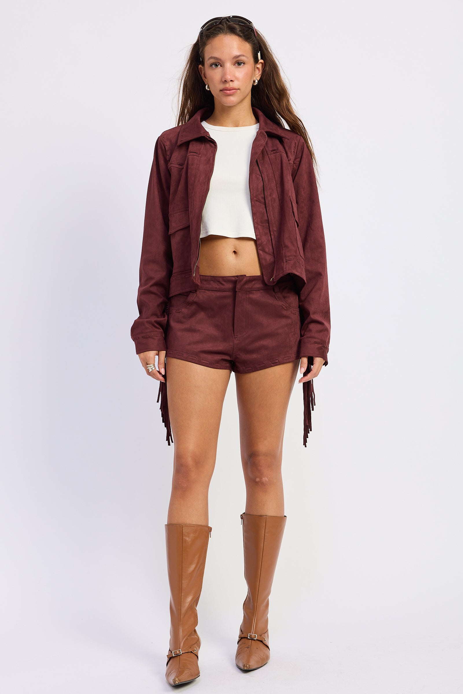 Wine faux suede fringe jacket with collared neckline, front pockets and tonal whipstitch detailing
