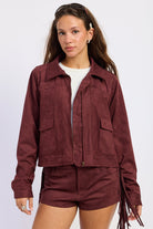 Wine faux suede fringe jacket with collared neckline, front pockets and tonal whipstitch detailing
