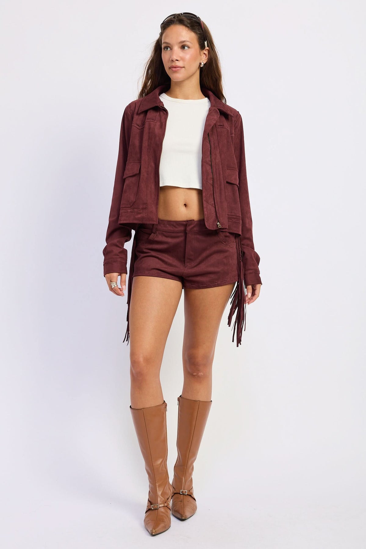 Woman wearing cropped suede-look jacket with collar and long sleeves in Wine.