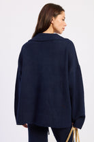 Back view of Harbor Lounge Navy Collared Sweater showing relaxed fit, wide collar and ribbed hem.