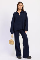 Harbor Lounge Navy Collared Sweater styled with coordinating navy wide leg knit pants, full front view.