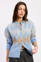 Front view of baby blue argyle zip cardigan with grey and camel diamond knit pattern and ribbed trim.