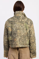 Back view of Wildwood camo puffer jacket showing woodland tree print and cropped hem.