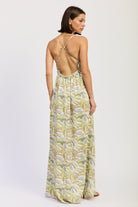 Green tropical print cutout maxi dress with V neckline and flowing skirt