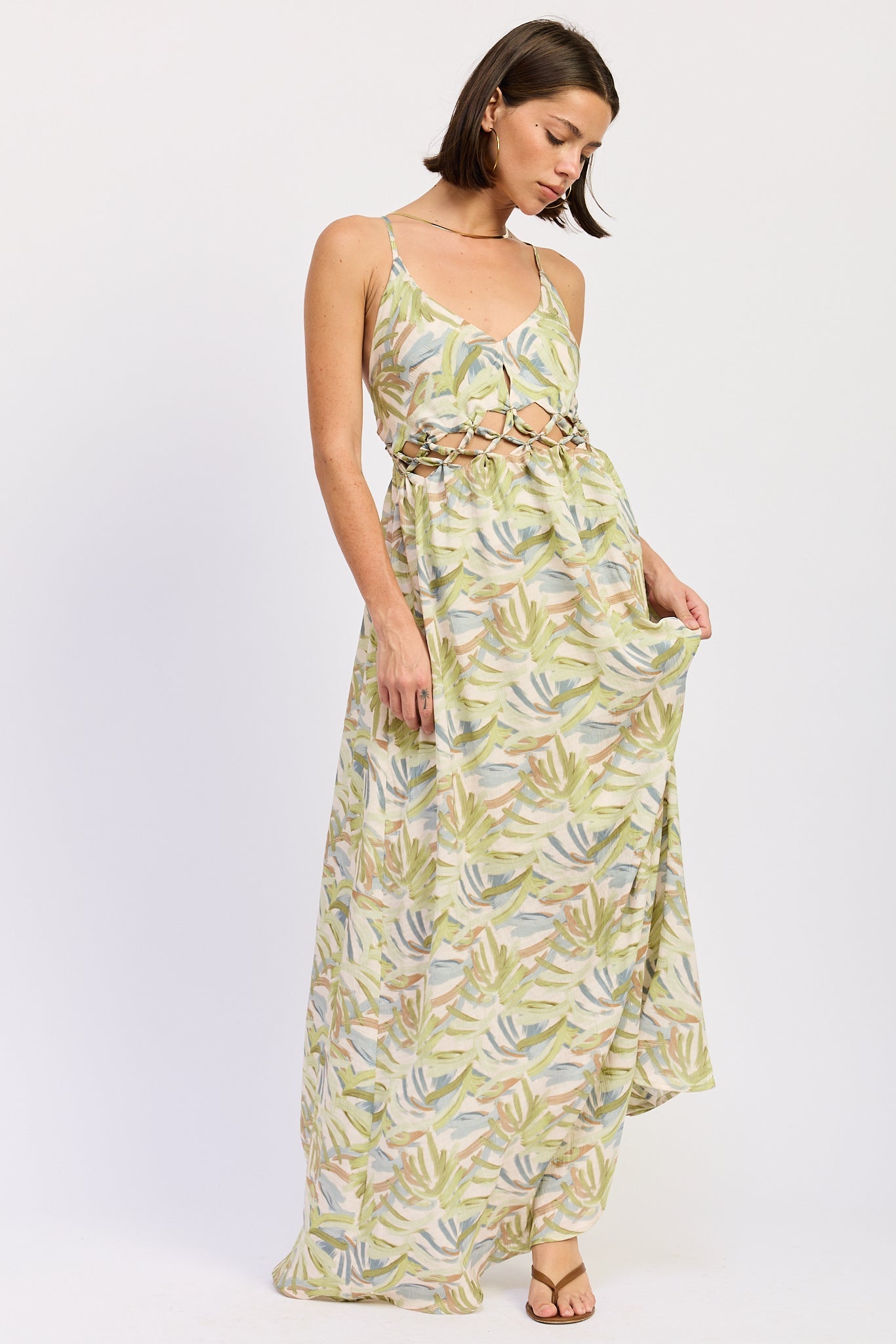 Green tropical print cutout maxi dress with V neckline and flowing skirt