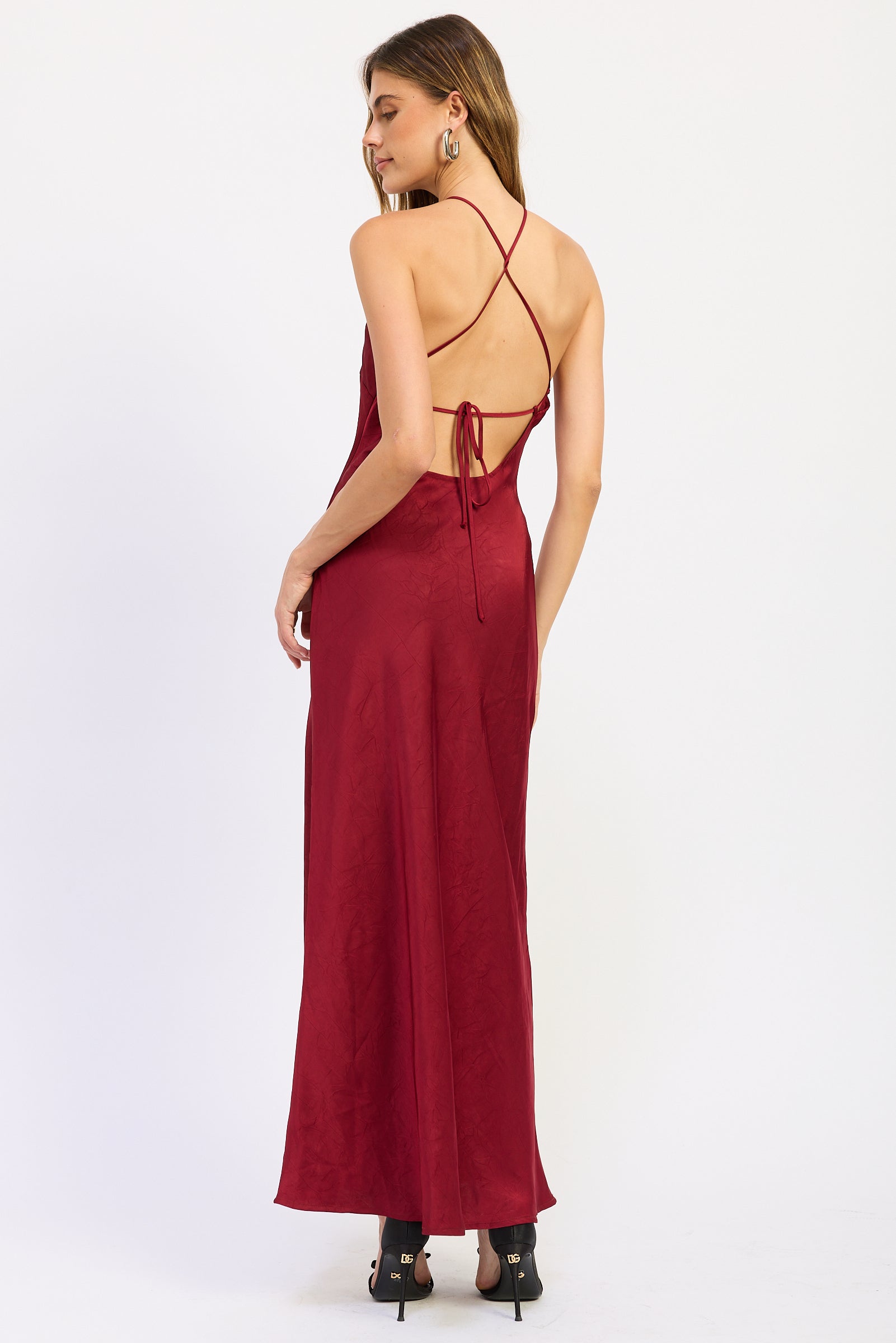 Back view of ruby red Seraphina Satin Halter Maxi Dress featuring crisscross straps, open back and adjustable tie
