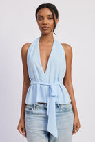Light blue halter top with deep V neckline and tie waist front view