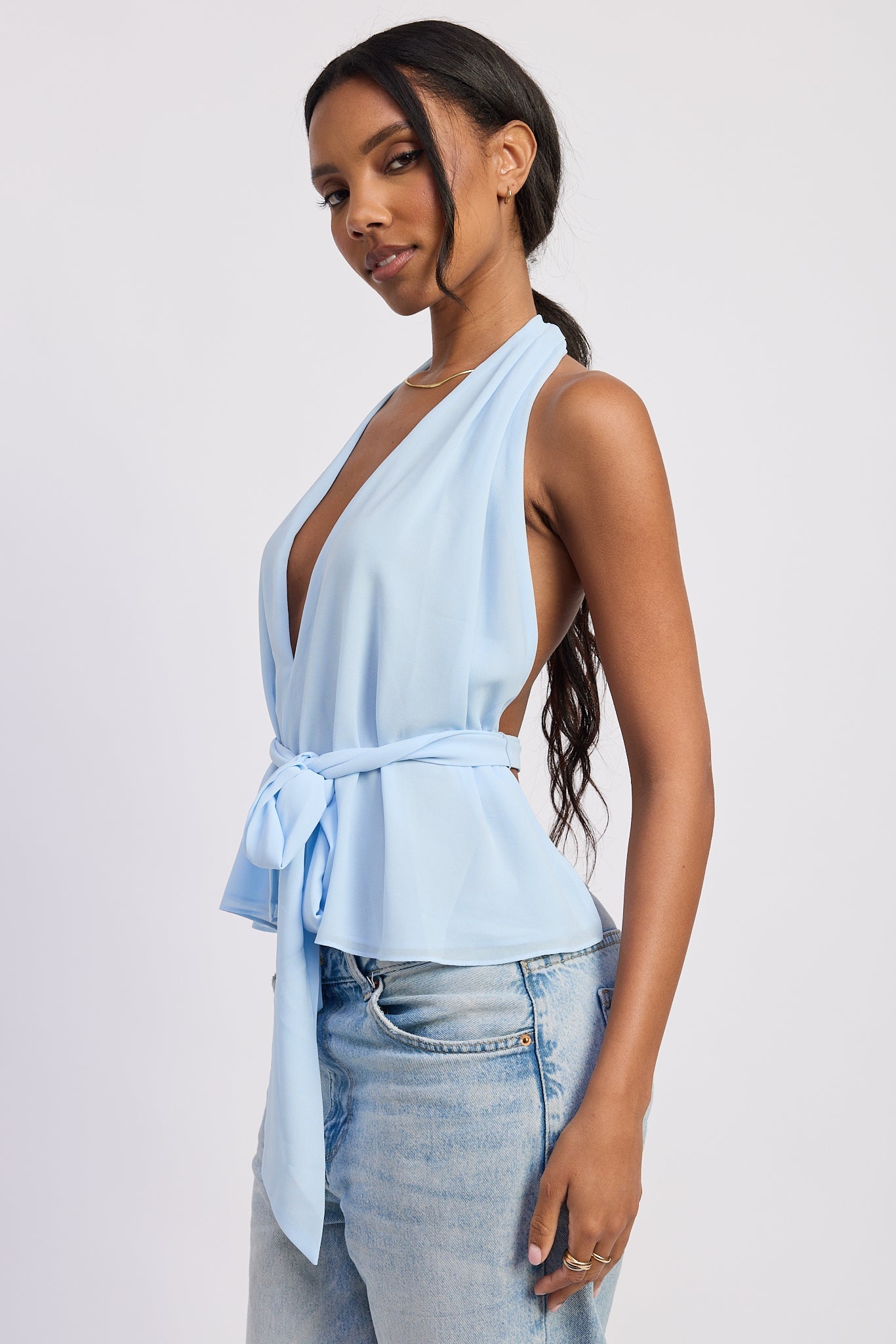 Light blue halter top with deep V neckline and tie waist side view