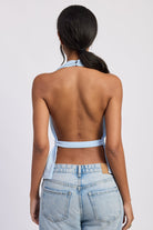 Light blue halter top with deep V neckline and tie waist back view