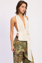 Ivory halter top with deep V neckline and tie waist front view