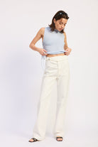 Woman wearing Buckle Wide Leg cream color cotton Pants on a white background front view