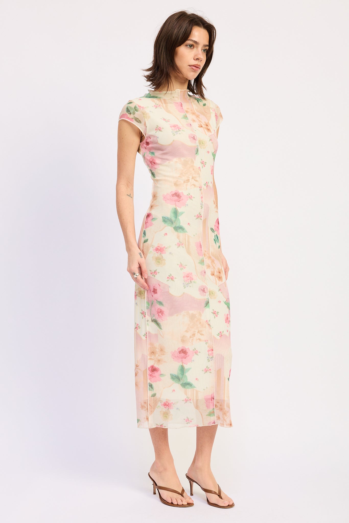 Woman wearing an ivory floral mesh midi dress front angle view on a white 