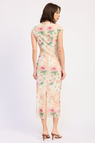 Woman wearing an ivory floral mesh midi dress back view on a white 