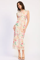 Woman wearing an ivory floral mesh midi dress front view on a white 