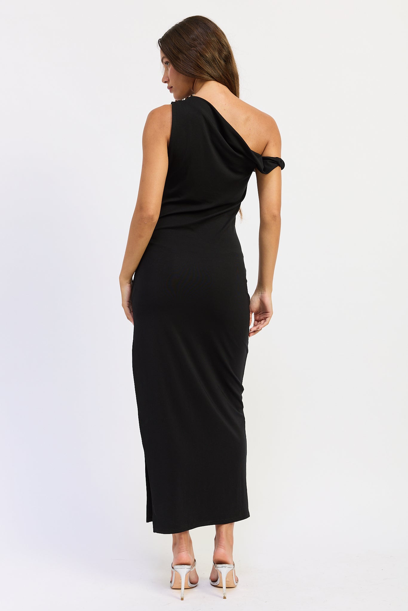 Black one shoulder maxi dress with asymmetrical draped neckline, back view.