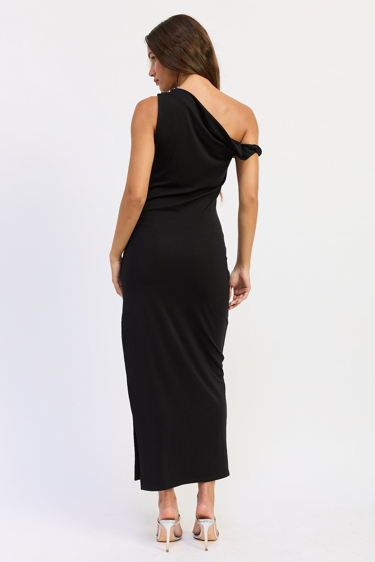 Black one shoulder maxi dress with asymmetrical draped neckline, back view.