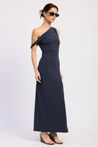 Navy one shoulder maxi dress with draped off shoulder detail and fitted silhouette, angled front view.