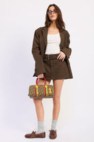 Easton Belted Faux Suede Mini Skirt in espresso brown styled with matching oversized blazer, front full-length view.