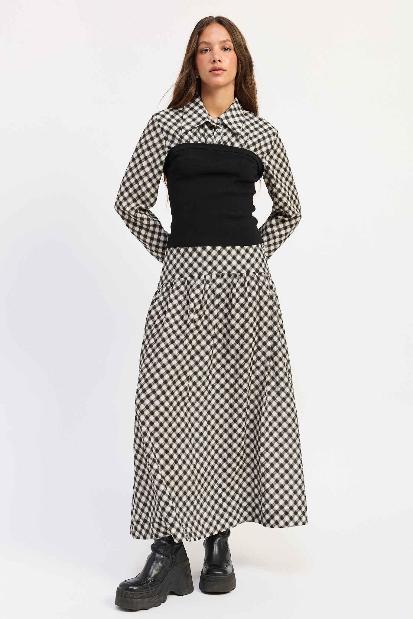 Thea black and ivory layered plaid collared top with fitted black contrast knit body, styled with the matching skirt.