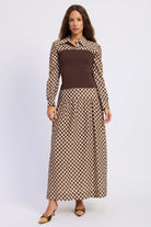 Thea espresso and ivory layered plaid collared top with fitted brown contrast knit body, styled with the matching skirt. 