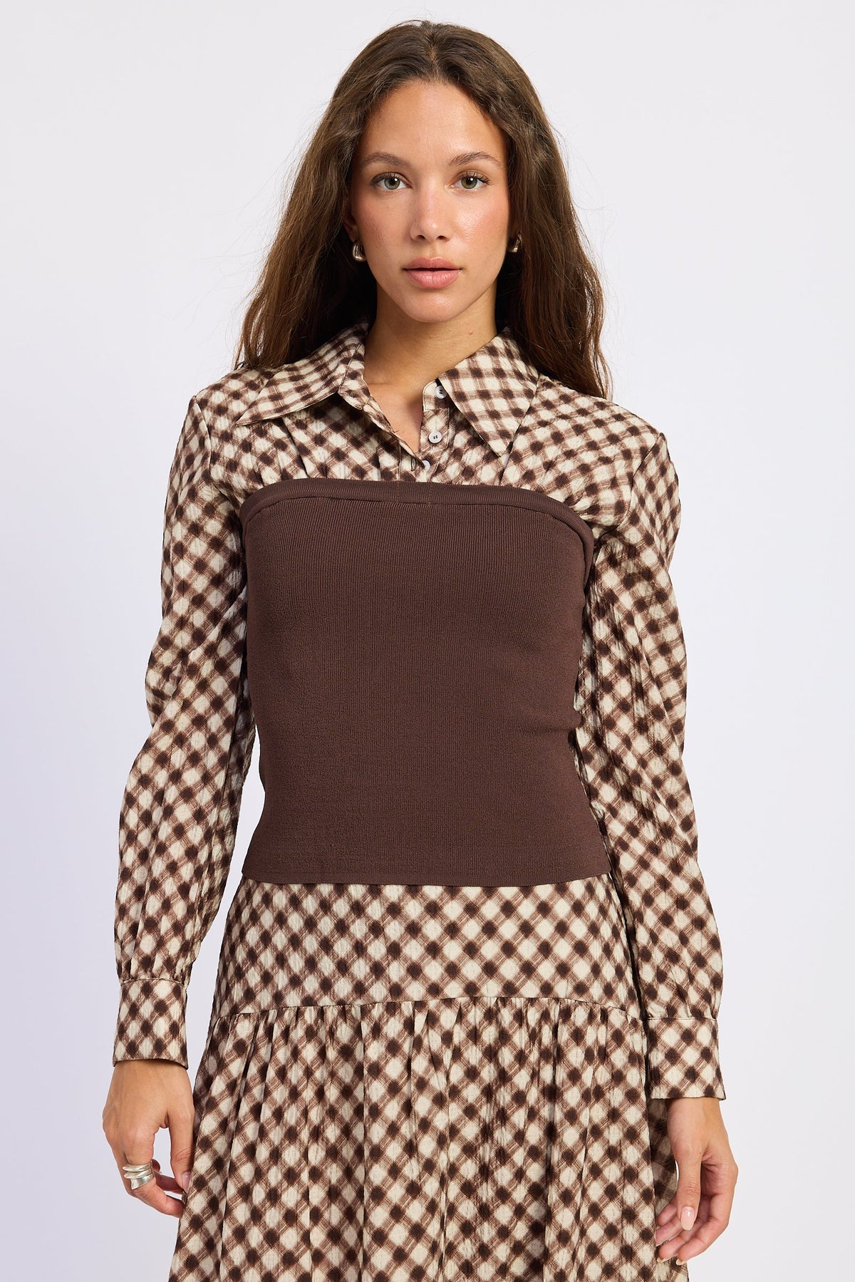Thea espresso and ivory layered plaid collared top with fitted brown contrast knit body, front view.