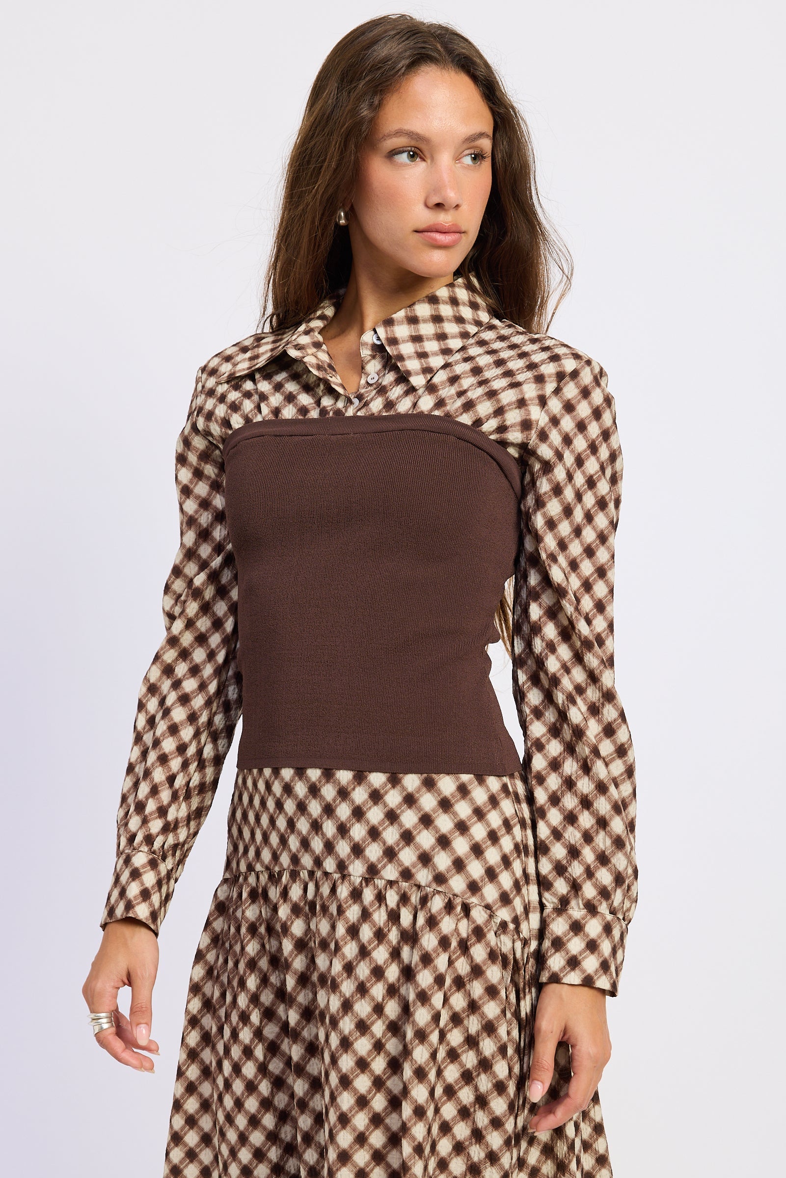 Angled front view of Thea espresso plaid collared top showing contrast knit body and long sleeves.