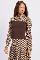Angled front view of Thea espresso plaid collared top showing contrast knit body and long sleeves.